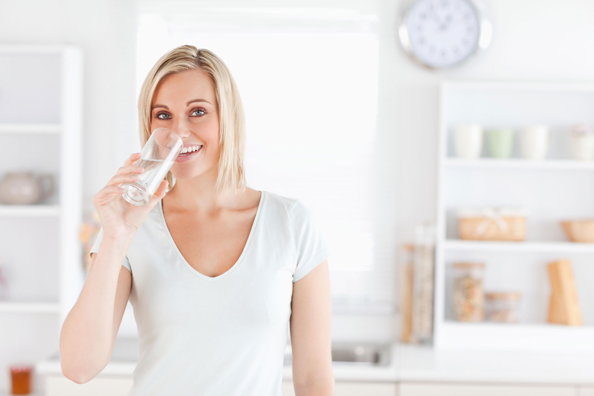 woman in white drinking 2 1920x1280 1